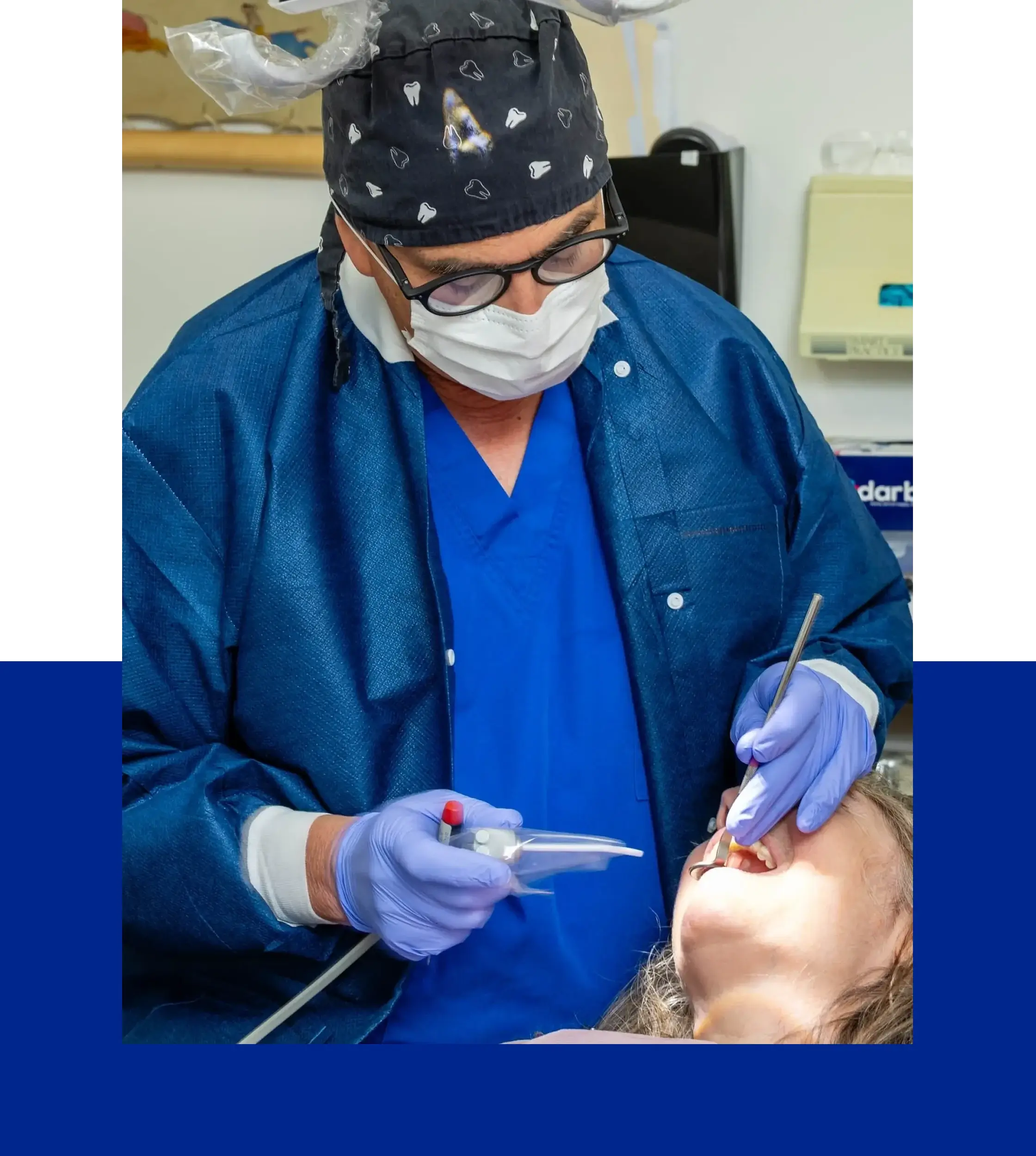 Dentist performing oral treatment on patient
