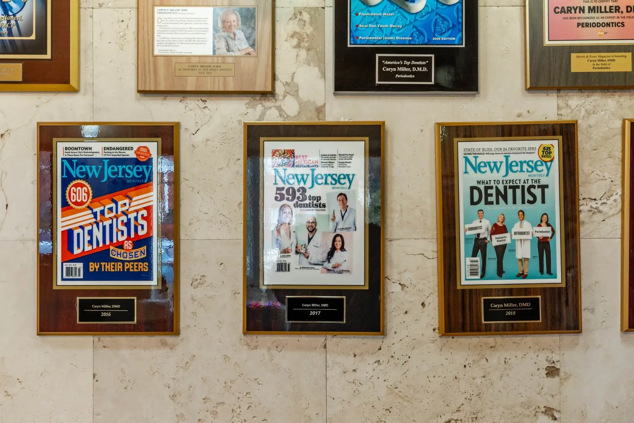 Wall of framed dental magazine covers